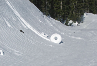 Illustration for article titled These bizarre snow rolls were actually created by the wind